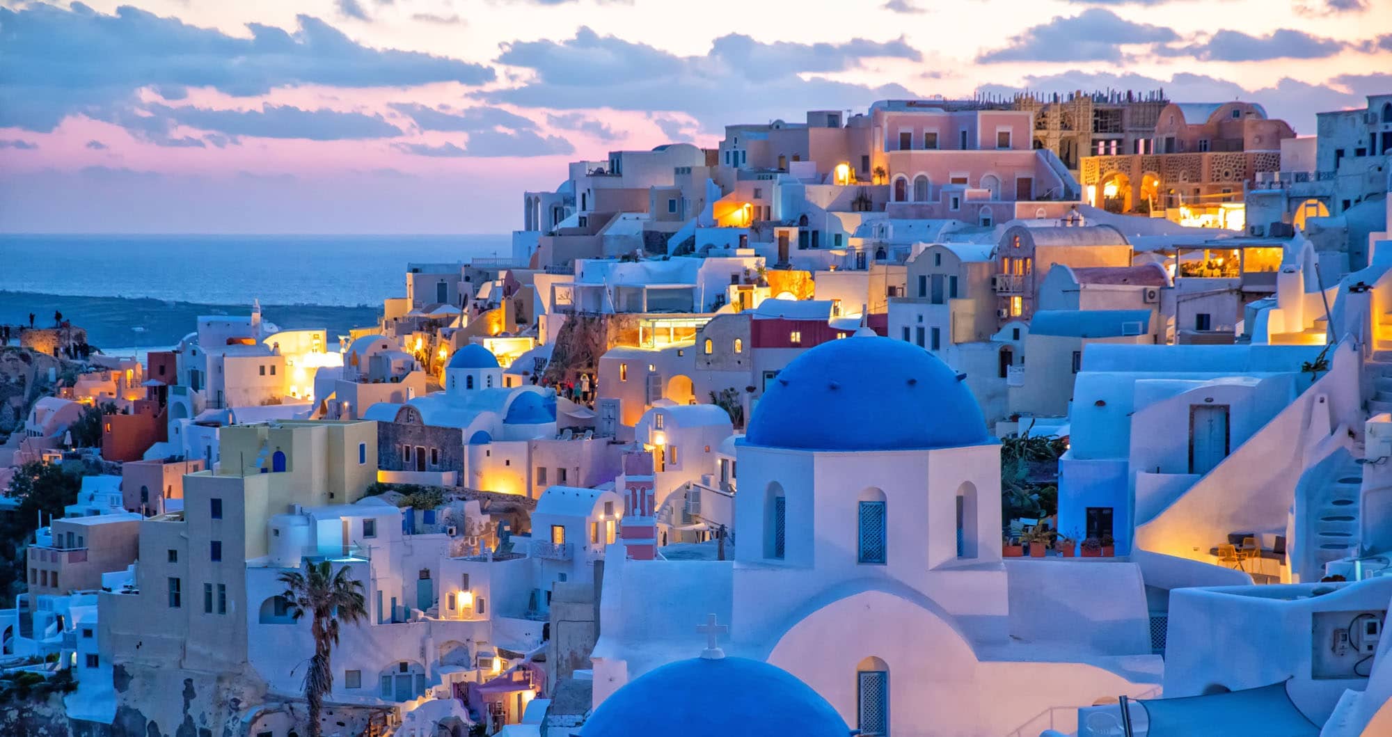 Oia village with blue domed churches and whitewashed buildings